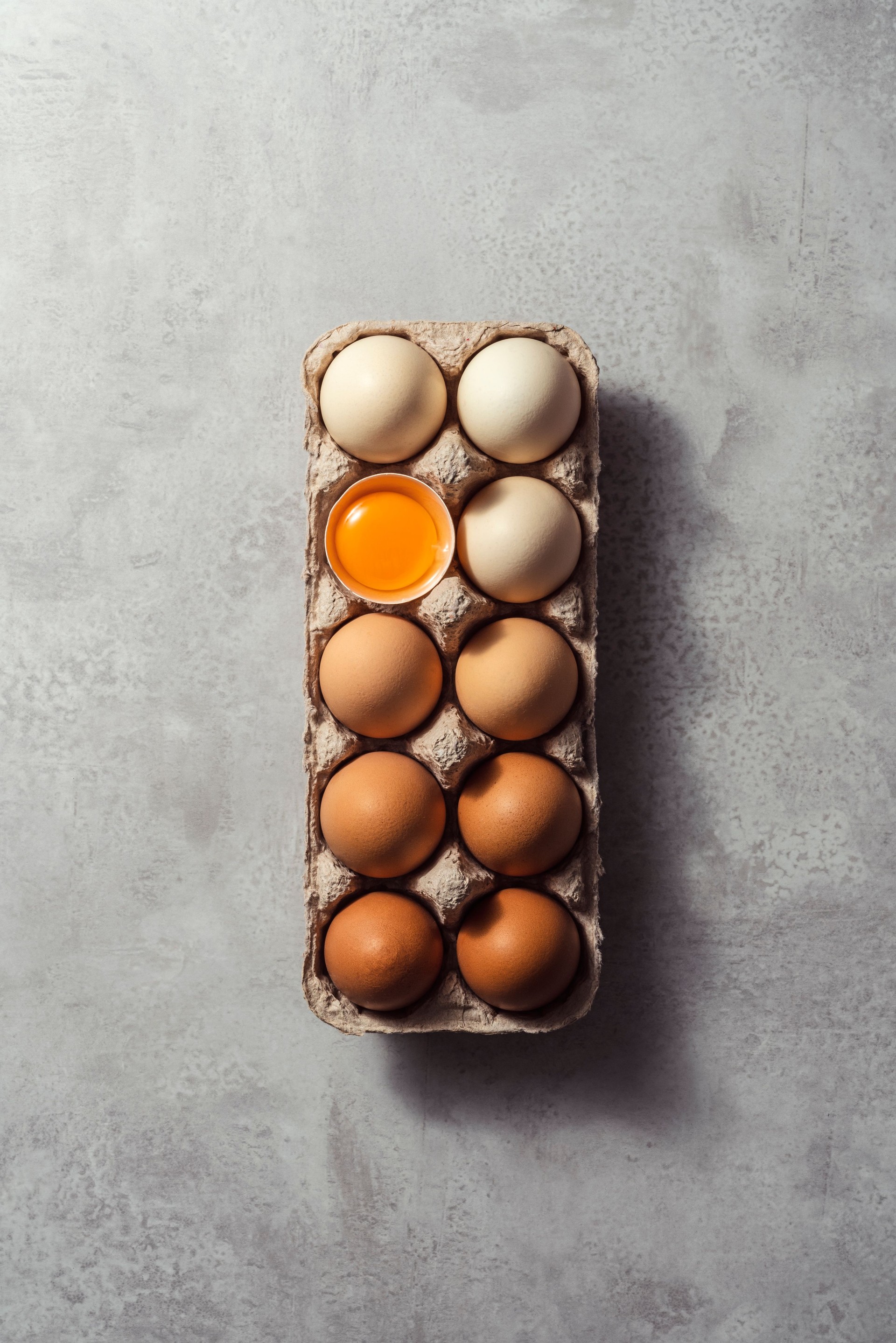 Box of eggs on grey background